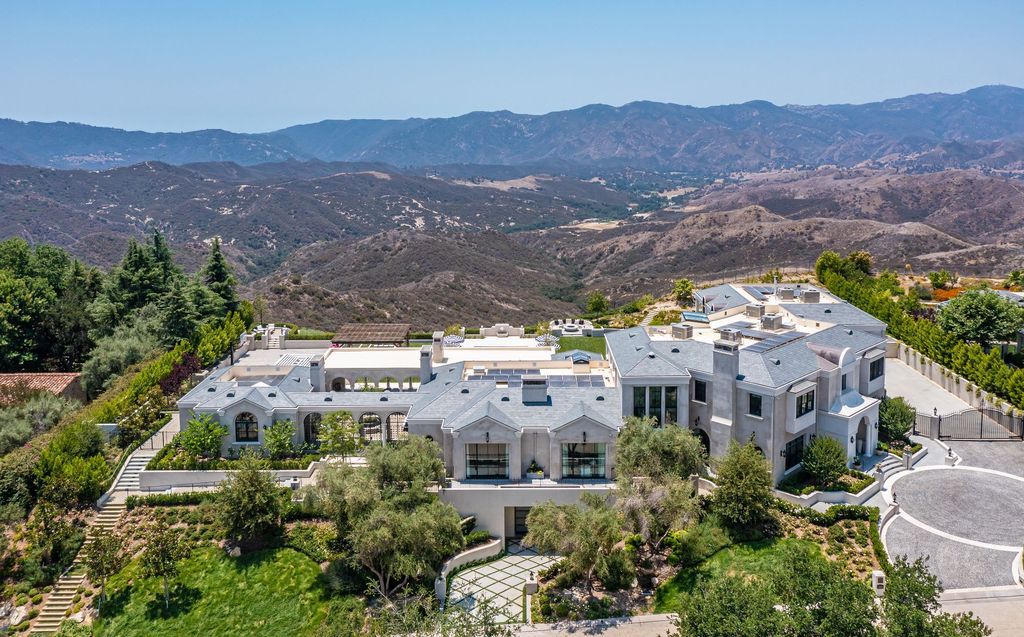 The French Mansion in California is a magnificent modern estate perched in the prestigious double-gated Estates at The Oaks of Calabasas now available for sale. This home located at 25314 Prado De La Felicidad, Calabasas, California