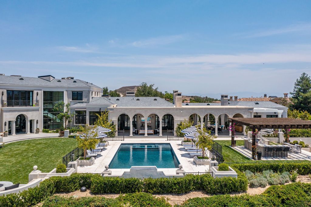 The French Mansion in California is a magnificent modern estate perched in the prestigious double-gated Estates at The Oaks of Calabasas now available for sale. This home located at 25314 Prado De La Felicidad, Calabasas, California