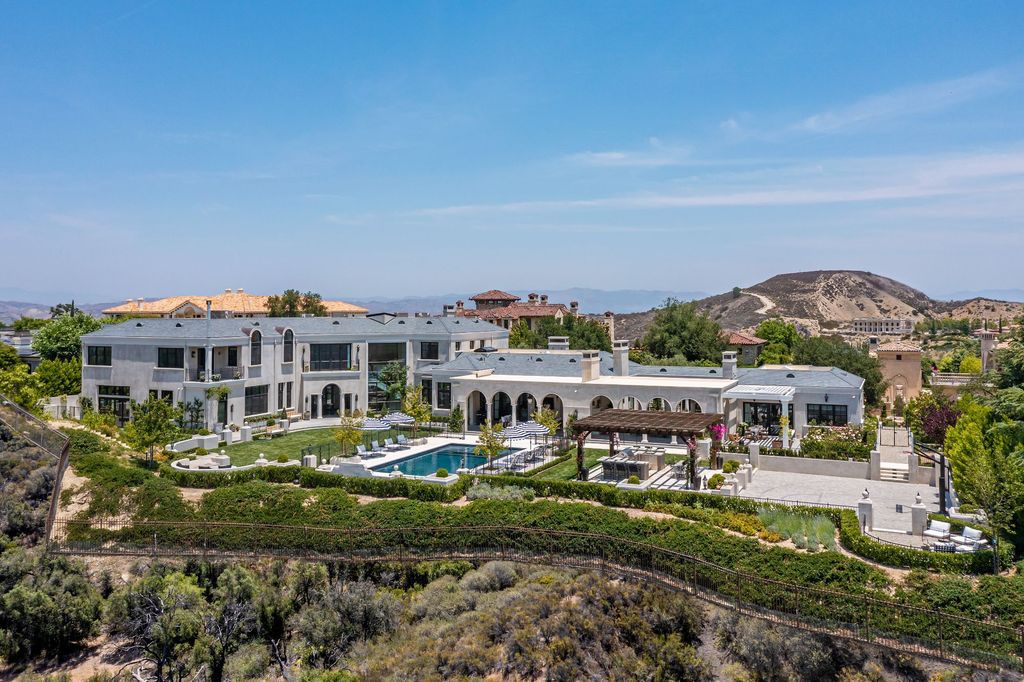 The French Mansion in California is a magnificent modern estate perched in the prestigious double-gated Estates at The Oaks of Calabasas now available for sale. This home located at 25314 Prado De La Felicidad, Calabasas, California
