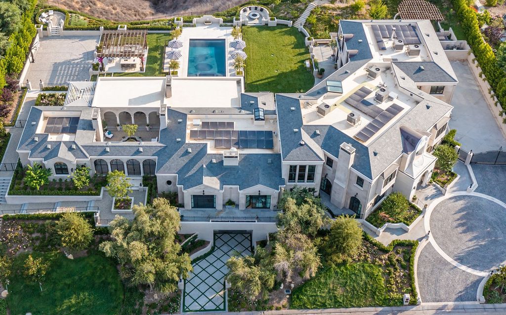The French Mansion in California is a magnificent modern estate perched in the prestigious double-gated Estates at The Oaks of Calabasas now available for sale. This home located at 25314 Prado De La Felicidad, Calabasas, California