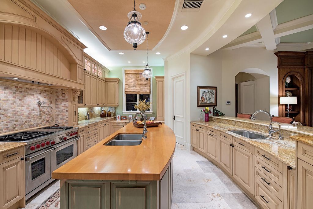 The Home in Naples is a luxurious custom built residence on one of the most sought after streets in Grey Oaks now available for sale. This home located at 2148 Canna Way, Naples, Florida