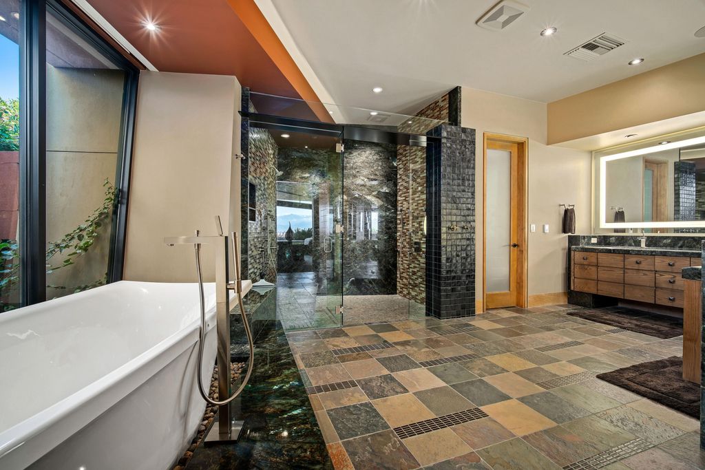 The Home in Rancho Mirage is a hillside estate with views of the Coachella Valley desert - One of the finest homes Mirada Estates now available for sale. This home located at 55 Granite Ridge Rd, Rancho Mirage, California