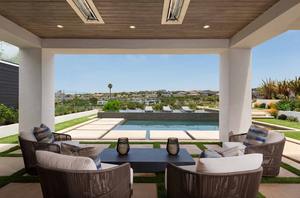 The Home in Corona Del Mar is a contemporary ocean view residence features sweeping ocean and Catalina views now available for sale. This home located at 409 De Sola Ter, Corona Del Mar, California