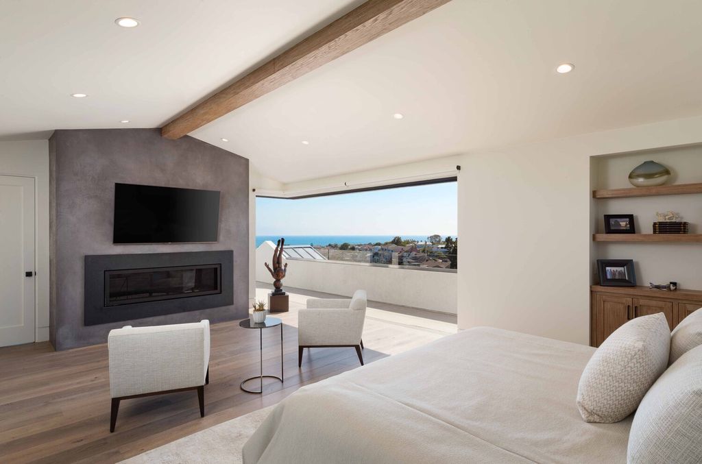 The Home in Corona Del Mar is a contemporary ocean view residence features sweeping ocean and Catalina views now available for sale. This home located at 409 De Sola Ter, Corona Del Mar, California