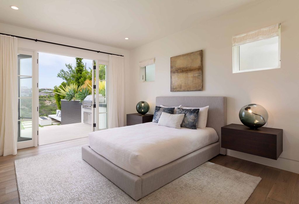 The Home in Corona Del Mar is a contemporary ocean view residence features sweeping ocean and Catalina views now available for sale. This home located at 409 De Sola Ter, Corona Del Mar, California