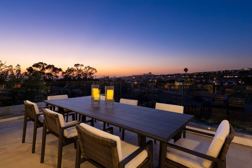 The Home in Corona Del Mar is a contemporary ocean view residence features sweeping ocean and Catalina views now available for sale. This home located at 409 De Sola Ter, Corona Del Mar, California
