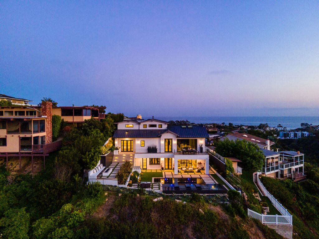 The Home in Corona Del Mar is a contemporary ocean view residence features sweeping ocean and Catalina views now available for sale. This home located at 409 De Sola Ter, Corona Del Mar, California