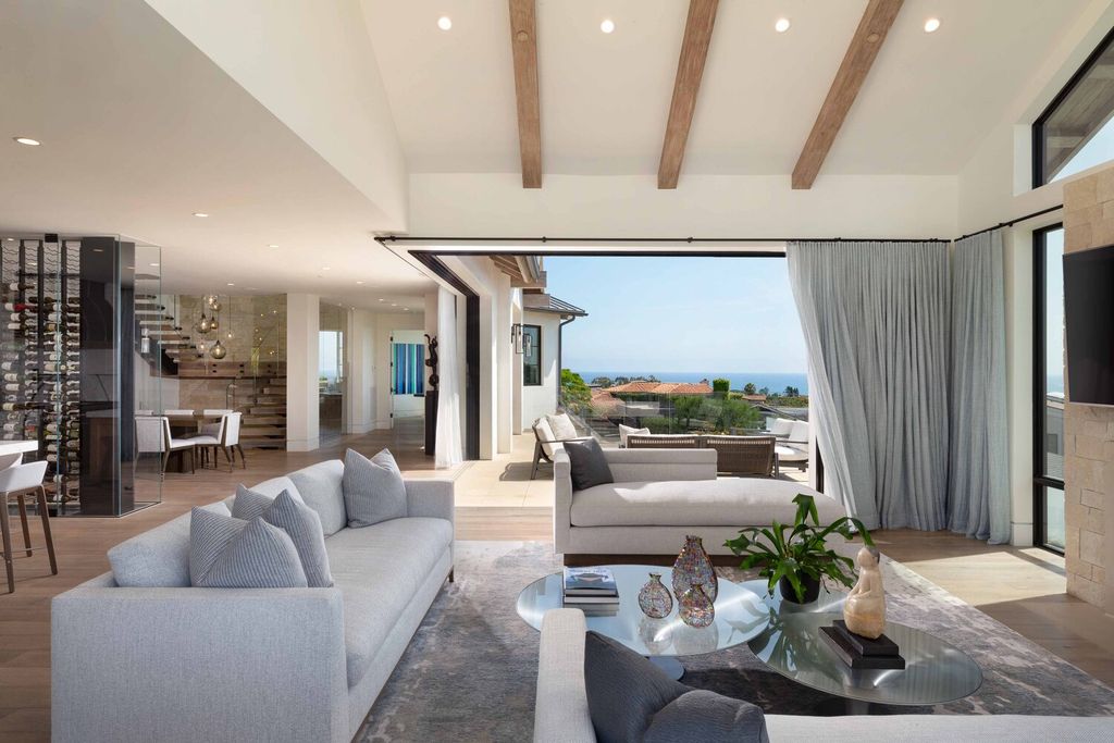 The Home in Corona Del Mar is a contemporary ocean view residence features sweeping ocean and Catalina views now available for sale. This home located at 409 De Sola Ter, Corona Del Mar, California