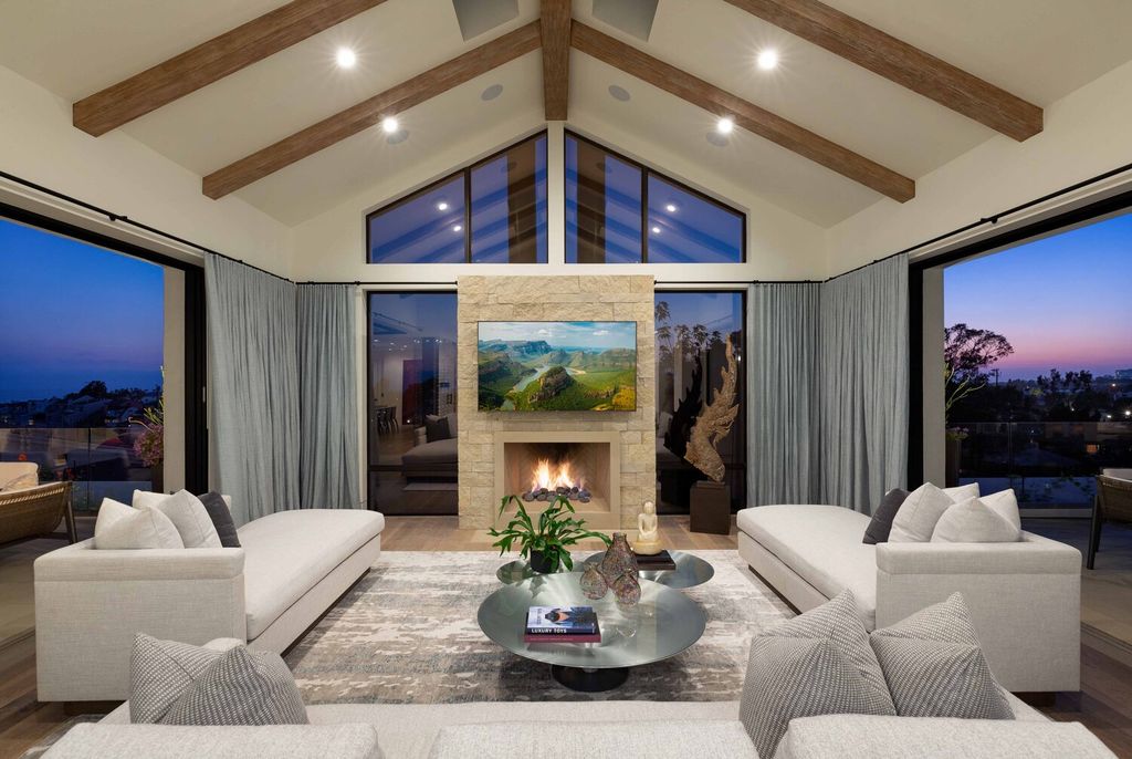 The Home in Corona Del Mar is a contemporary ocean view residence features sweeping ocean and Catalina views now available for sale. This home located at 409 De Sola Ter, Corona Del Mar, California