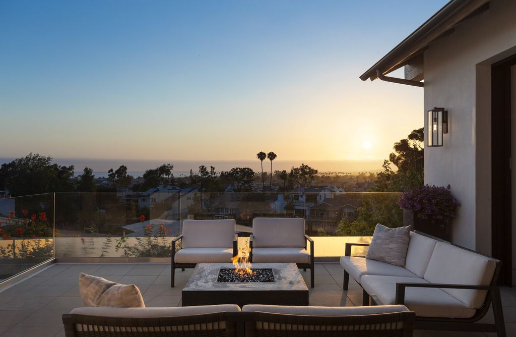 The Home in Corona Del Mar is a contemporary ocean view residence features sweeping ocean and Catalina views now available for sale. This home located at 409 De Sola Ter, Corona Del Mar, California