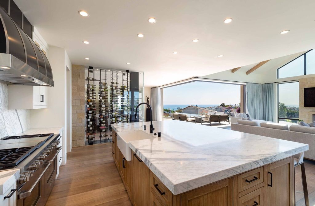 The Home in Corona Del Mar is a contemporary ocean view residence features sweeping ocean and Catalina views now available for sale. This home located at 409 De Sola Ter, Corona Del Mar, California