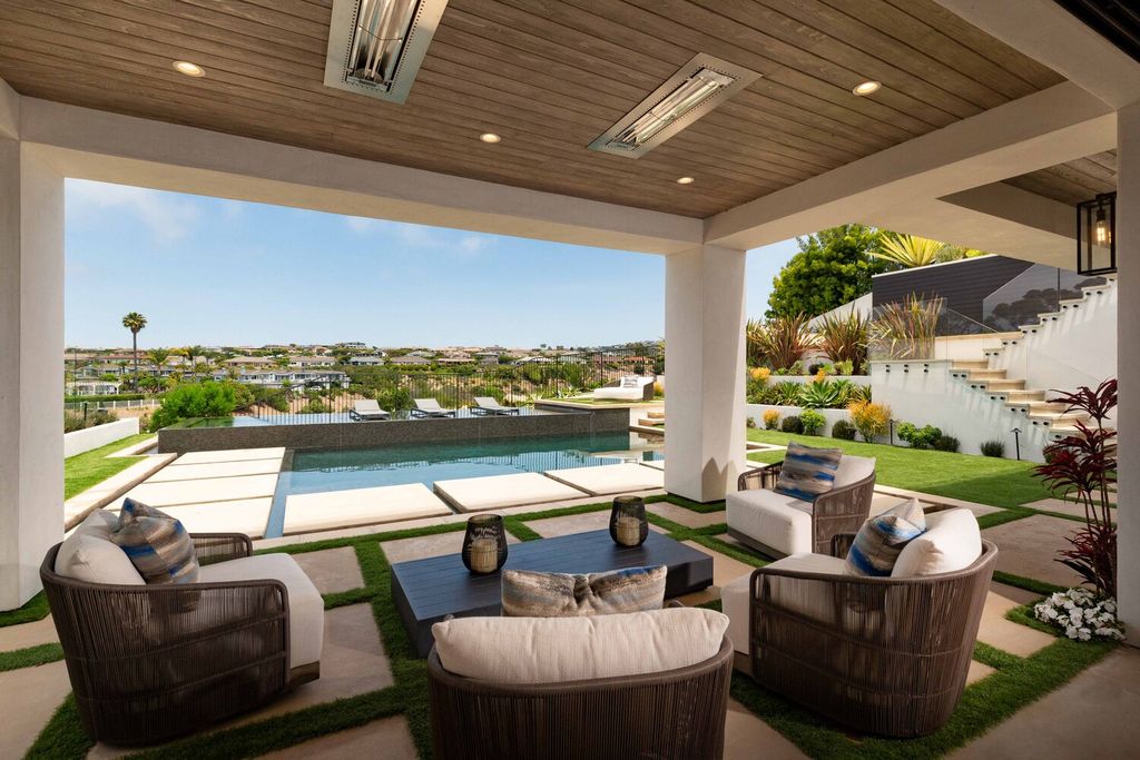 The Home in Corona Del Mar is a contemporary ocean view residence features sweeping ocean and Catalina views now available for sale. This home located at 409 De Sola Ter, Corona Del Mar, California