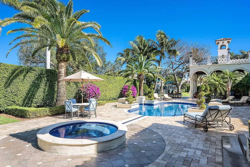 The Boca Raton Home is a luxurious five-bedroom estate complemented by the refreshed decor, seamlessly blending clean lines and traditional elegance now available for sale. This home located at 1869 Sabal Palm Dr, Boca Raton, Florida
