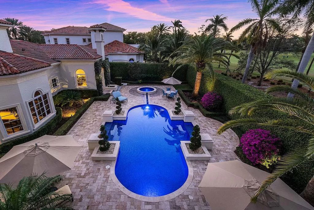 The Boca Raton Home is a luxurious five-bedroom estate complemented by the refreshed decor, seamlessly blending clean lines and traditional elegance now available for sale. This home located at 1869 Sabal Palm Dr, Boca Raton, Florida