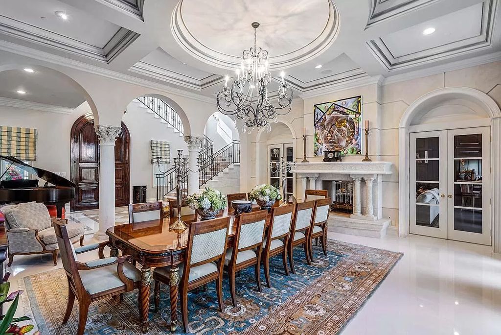 The Boca Raton Home is a luxurious five-bedroom estate complemented by the refreshed decor, seamlessly blending clean lines and traditional elegance now available for sale. This home located at 1869 Sabal Palm Dr, Boca Raton, Florida
