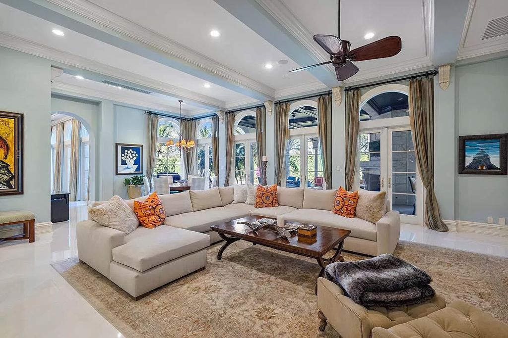The Boca Raton Home is a luxurious five-bedroom estate complemented by the refreshed decor, seamlessly blending clean lines and traditional elegance now available for sale. This home located at 1869 Sabal Palm Dr, Boca Raton, Florida