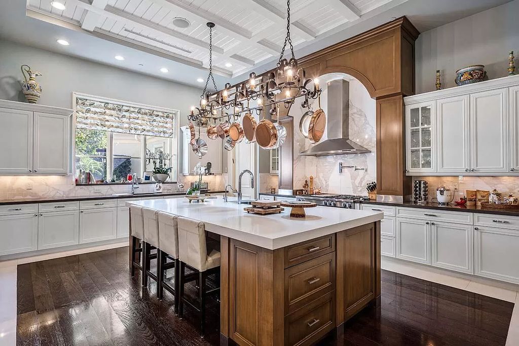 The Boca Raton Home is a luxurious five-bedroom estate complemented by the refreshed decor, seamlessly blending clean lines and traditional elegance now available for sale. This home located at 1869 Sabal Palm Dr, Boca Raton, Florida