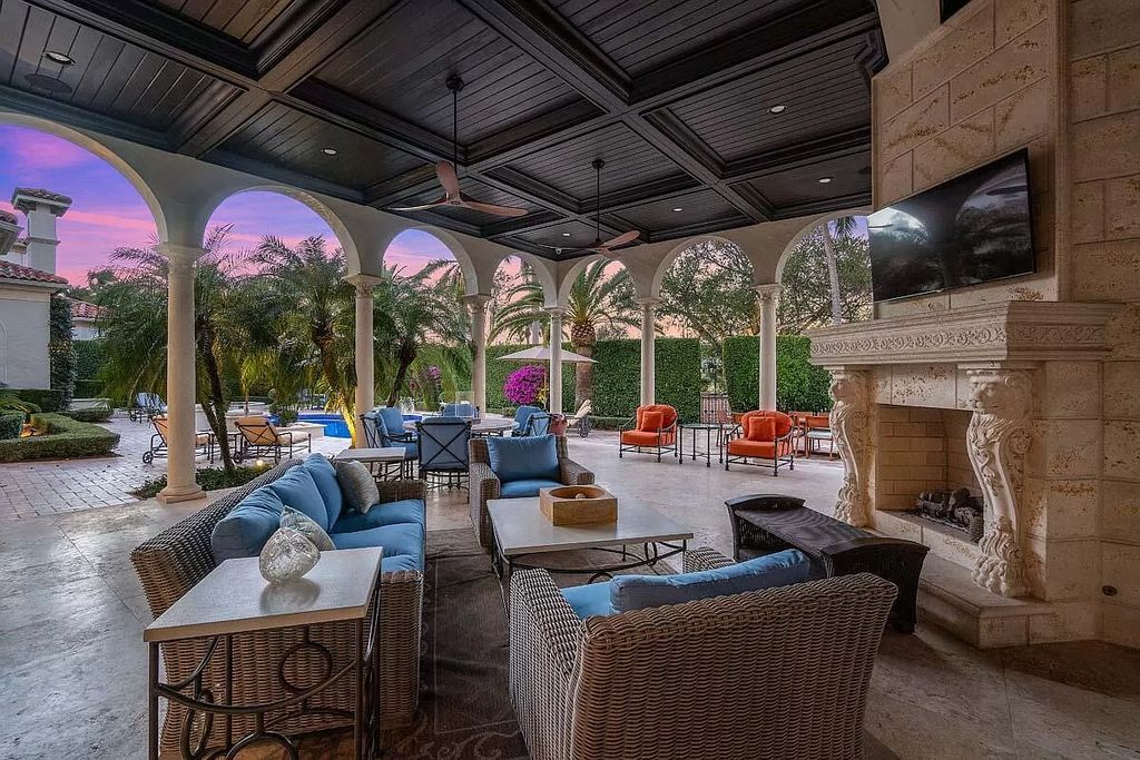 The Boca Raton Home is a luxurious five-bedroom estate complemented by the refreshed decor, seamlessly blending clean lines and traditional elegance now available for sale. This home located at 1869 Sabal Palm Dr, Boca Raton, Florida