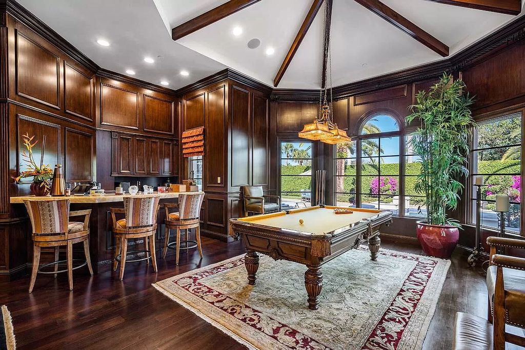 The Boca Raton Home is a luxurious five-bedroom estate complemented by the refreshed decor, seamlessly blending clean lines and traditional elegance now available for sale. This home located at 1869 Sabal Palm Dr, Boca Raton, Florida