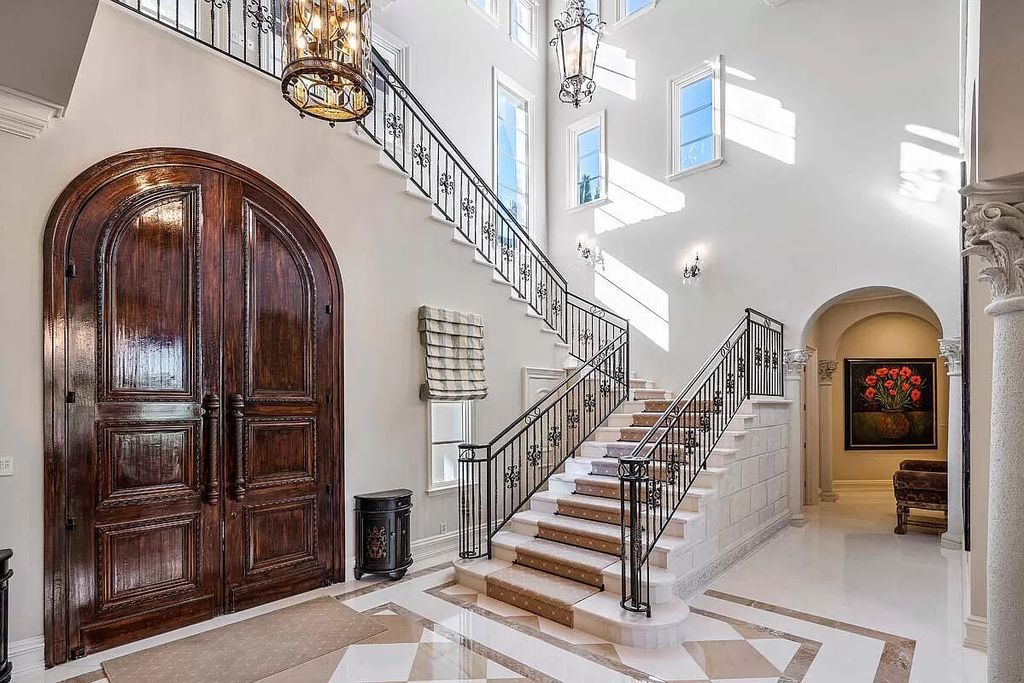 The Boca Raton Home is a luxurious five-bedroom estate complemented by the refreshed decor, seamlessly blending clean lines and traditional elegance now available for sale. This home located at 1869 Sabal Palm Dr, Boca Raton, Florida