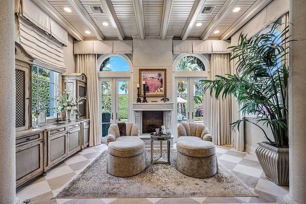 The Boca Raton Home is a luxurious five-bedroom estate complemented by the refreshed decor, seamlessly blending clean lines and traditional elegance now available for sale. This home located at 1869 Sabal Palm Dr, Boca Raton, Florida