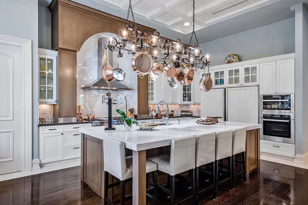 The Boca Raton Home is a luxurious five-bedroom estate complemented by the refreshed decor, seamlessly blending clean lines and traditional elegance now available for sale. This home located at 1869 Sabal Palm Dr, Boca Raton, Florida