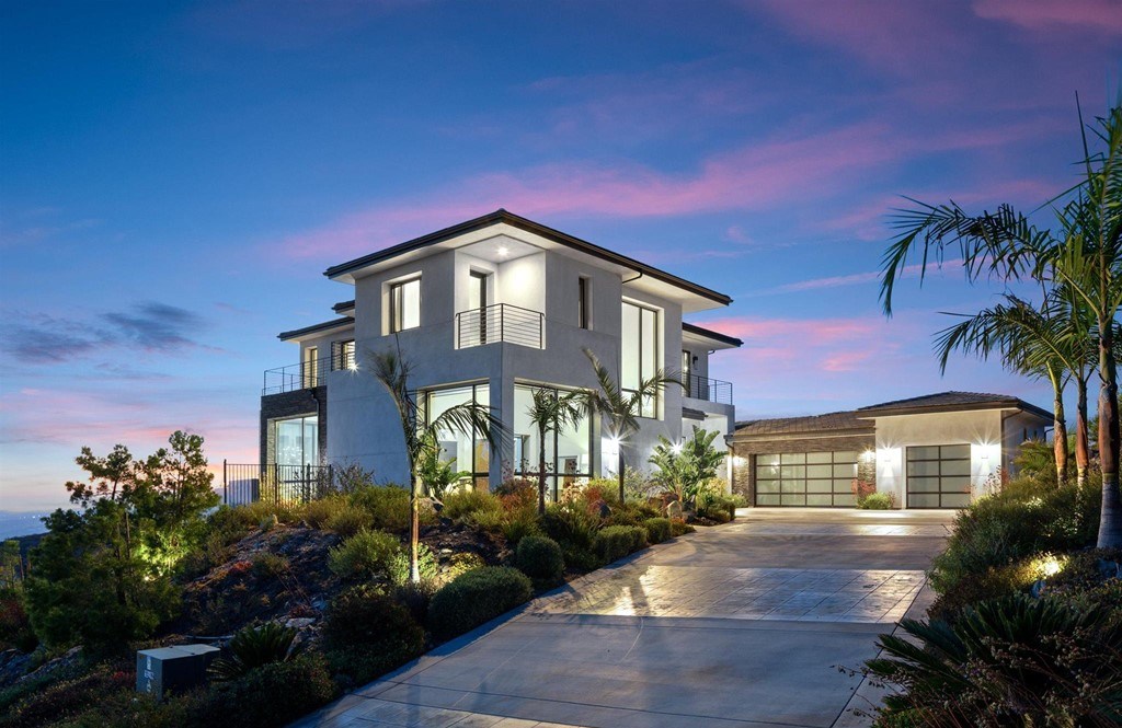 The Rancho Santa Fe Home is a private modern estate with breathtaking views of the ocean, canyons, and mountains in the community of Cielo now available for sale. This home located at 8370 Via Rancho Cielo, Rancho Santa Fe, California