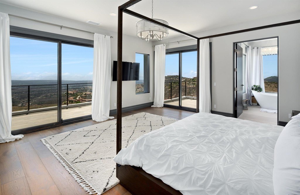 The Rancho Santa Fe Home is a private modern estate with breathtaking views of the ocean, canyons, and mountains in the community of Cielo now available for sale. This home located at 8370 Via Rancho Cielo, Rancho Santa Fe, California