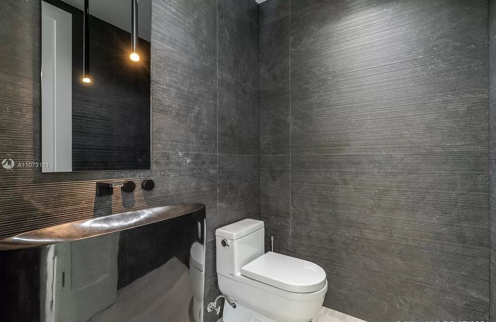 The Home in Miami Beach is a custom built masterpiece offers 6,000 sf of meticulously crafted living space along with gorgeous finishes now available for sale. This home located at 672 S Shore Dr, Miami Beach, Florida
