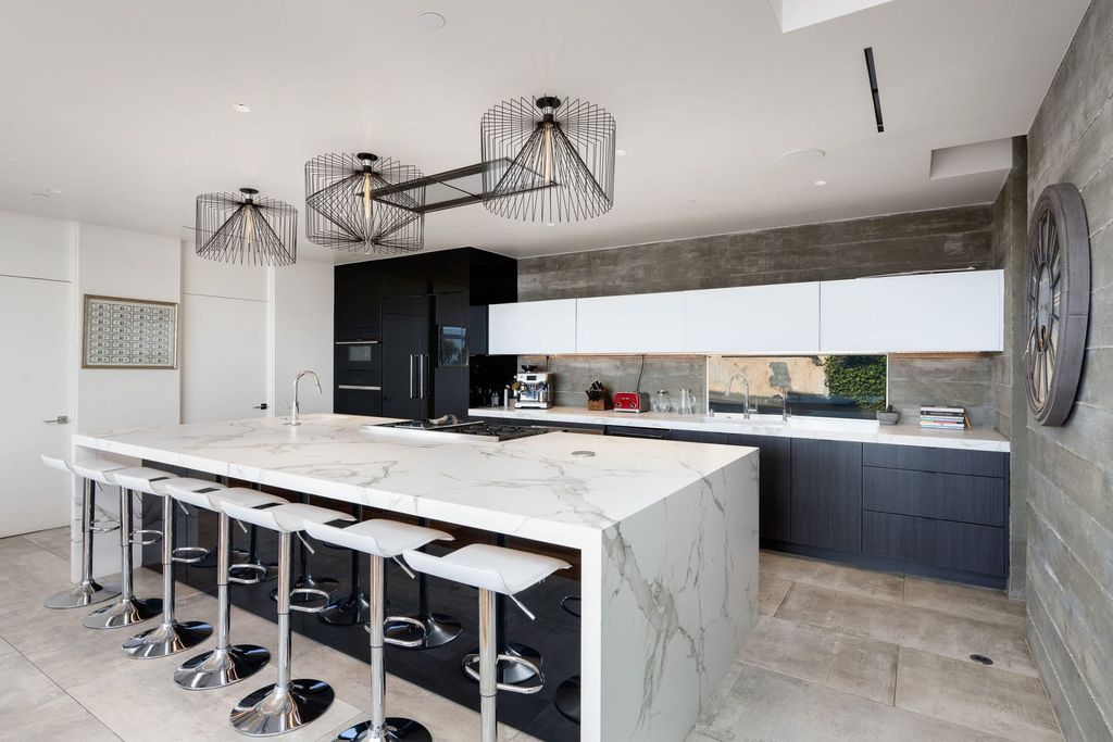 The Home in Los Angeles is a distinguished architectural masterpiece sited in prime Bel Air boasts panoramic city, ocean, and mountain views now available for sale. This home located at 1979 Stradella Rd, Los Angeles, California