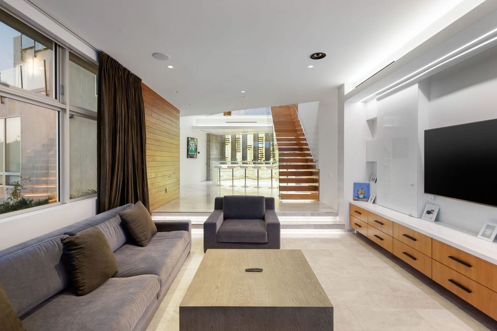 The Home in Los Angeles is a distinguished architectural masterpiece sited in prime Bel Air boasts panoramic city, ocean, and mountain views now available for sale. This home located at 1979 Stradella Rd, Los Angeles, California
