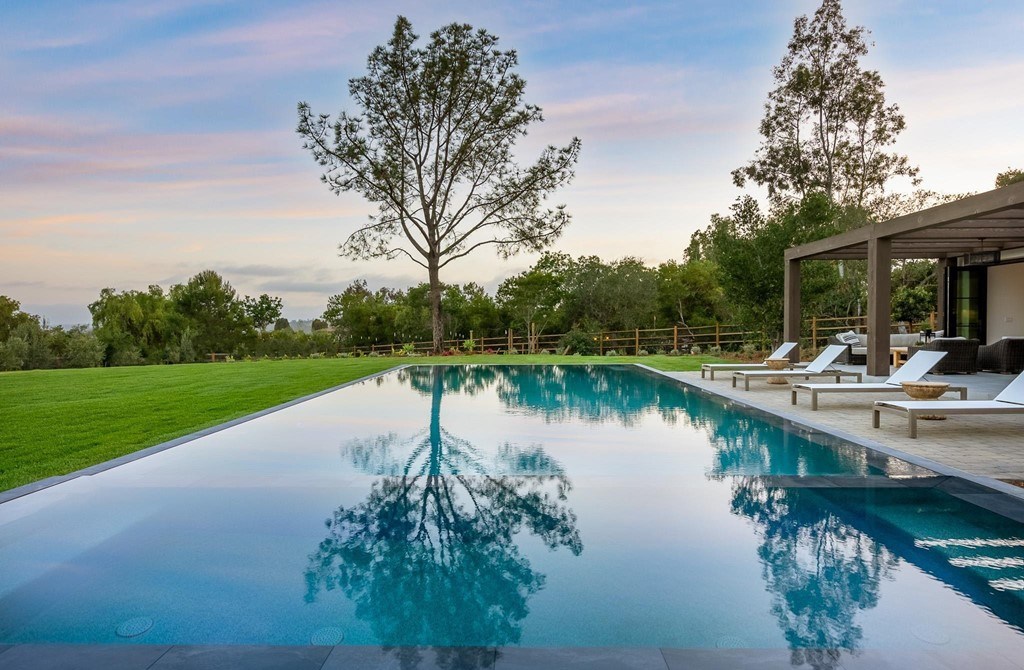 The Home in Rancho Santa Fe is a brand new estate with An impressive open-living great room boasts a soaring ceiling now available for sale. This home located at 16836 El Zorro Vis, Rancho Santa Fe, California