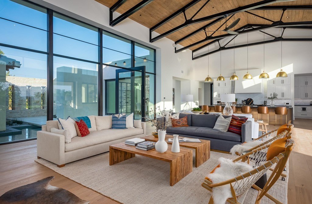 The Home in Rancho Santa Fe is a brand new estate with An impressive open-living great room boasts a soaring ceiling now available for sale. This home located at 16836 El Zorro Vis, Rancho Santa Fe, California
