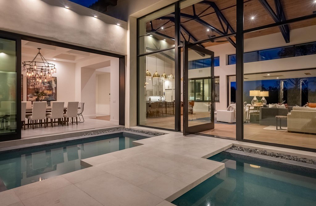 The Home in Rancho Santa Fe is a brand new estate with An impressive open-living great room boasts a soaring ceiling now available for sale. This home located at 16836 El Zorro Vis, Rancho Santa Fe, California