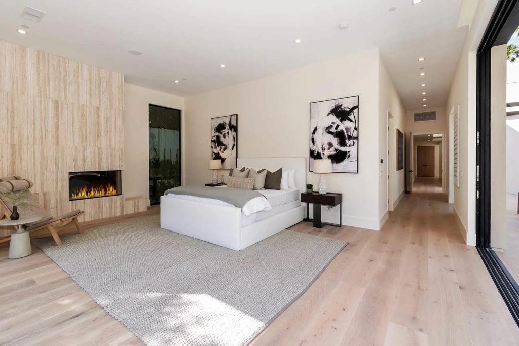 The Home in Beverly Hills is a captivating reimagined single-story sanctuary, situated behind private gates now available for sale. This home located at 410 Doheny Rd, Beverly Hills, California