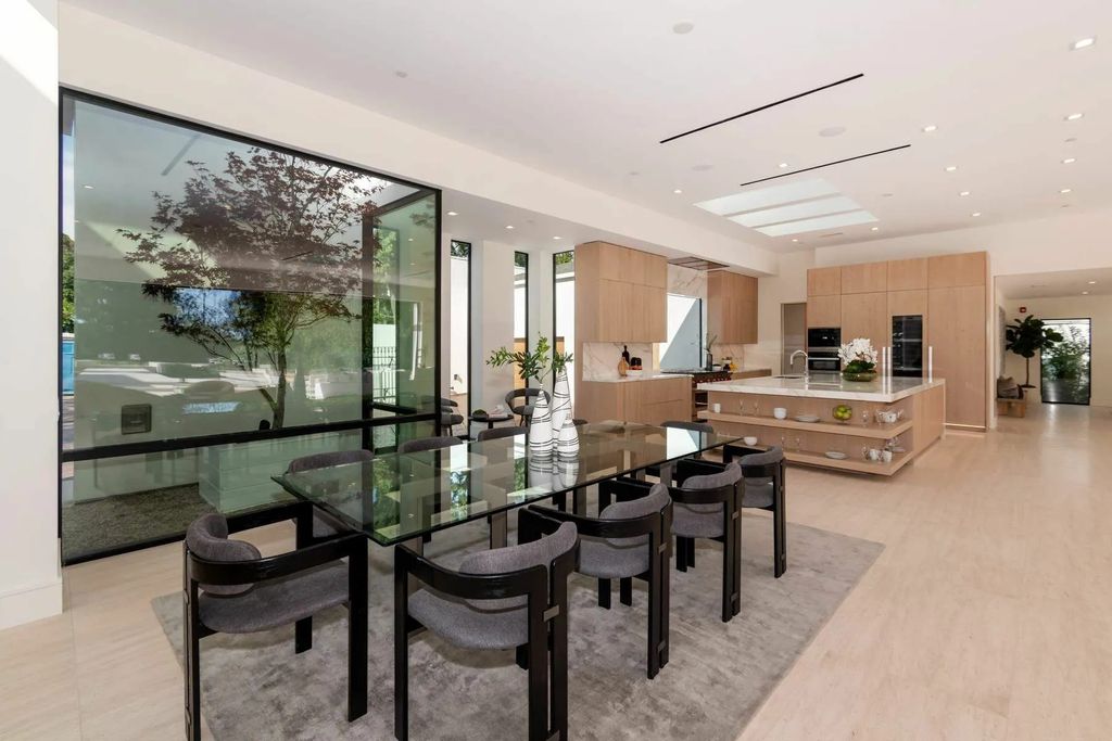 The Home in Beverly Hills is a captivating reimagined single-story sanctuary, situated behind private gates now available for sale. This home located at 410 Doheny Rd, Beverly Hills, California