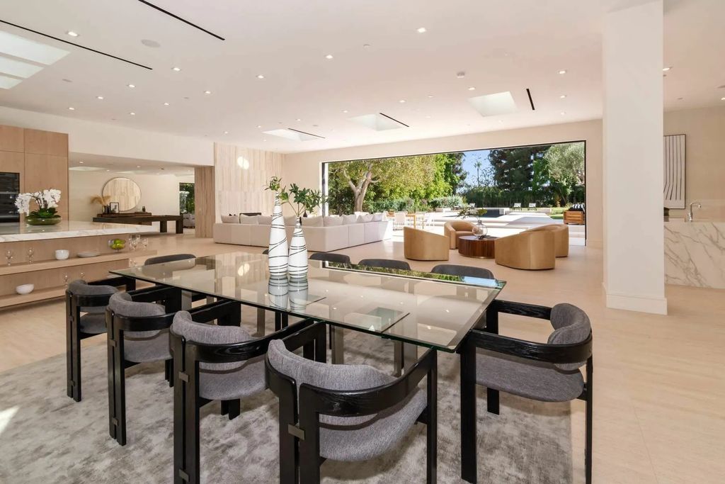 The Home in Beverly Hills is a captivating reimagined single-story sanctuary, situated behind private gates now available for sale. This home located at 410 Doheny Rd, Beverly Hills, California