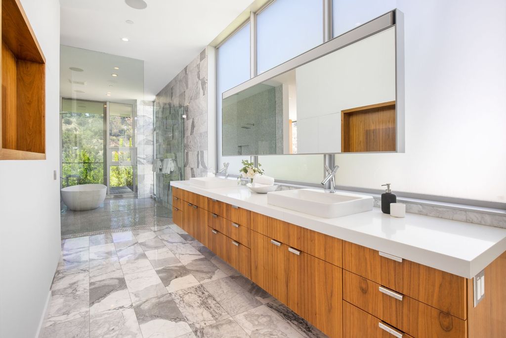 The Home in Los Angeles is a newly built modern architectural estate with the explosive city and canyon views now available for sale. This home located at 1967 Mount Olympus Dr, Los Angeles, California