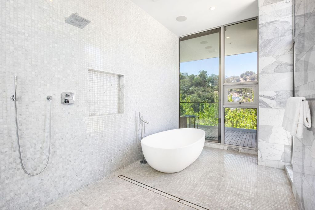 The Home in Los Angeles is a newly built modern architectural estate with the explosive city and canyon views now available for sale. This home located at 1967 Mount Olympus Dr, Los Angeles, California
