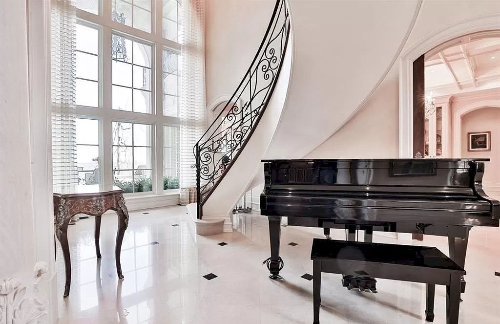 The Incredible Parisian Chateau in Ontario is a waterfront home now available for sale. This home is located at 2064 Lakeshore Rd E, Oakville, ON L6J 1M3, Canada