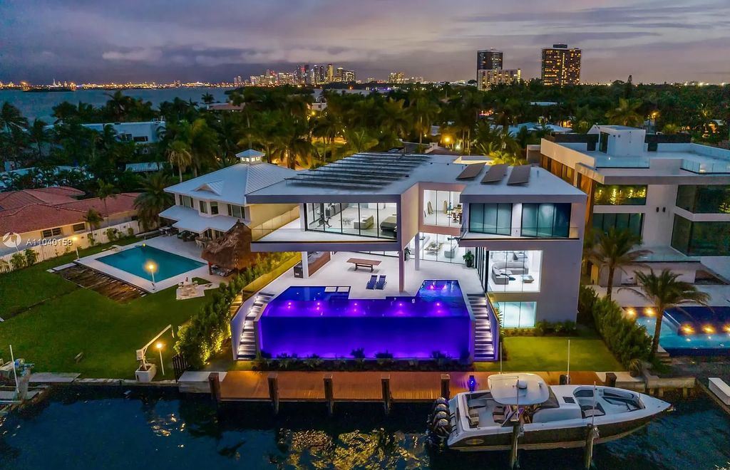 The Home in Miami is a brand new luxury modern estate with stunning bay views and over 100 feet of linear waterfront now available for sale. This home located at 1133 Belle Meade Island Dr, Miami, Florida