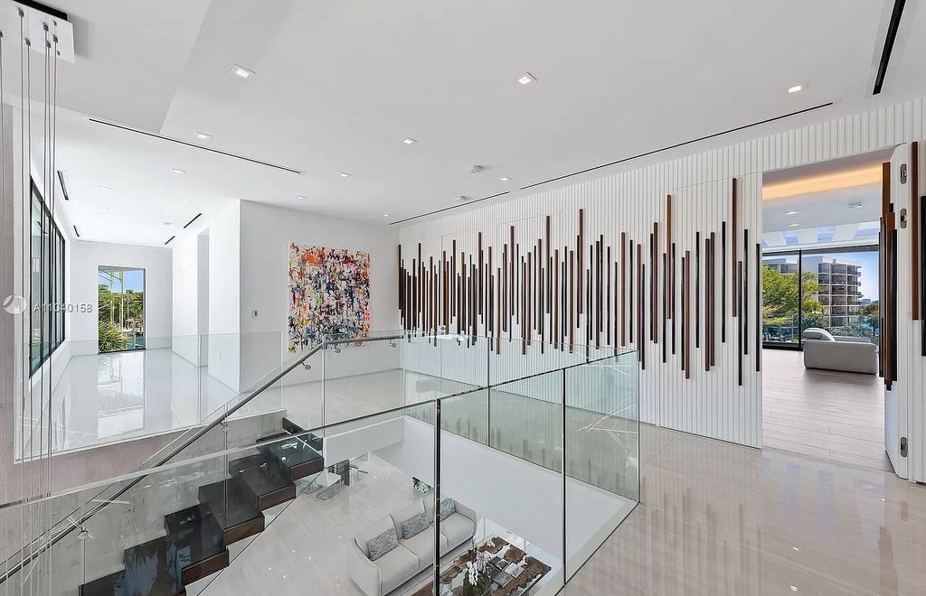 The Home in Miami is a brand new luxury modern estate with stunning bay views and over 100 feet of linear waterfront now available for sale. This home located at 1133 Belle Meade Island Dr, Miami, Florida