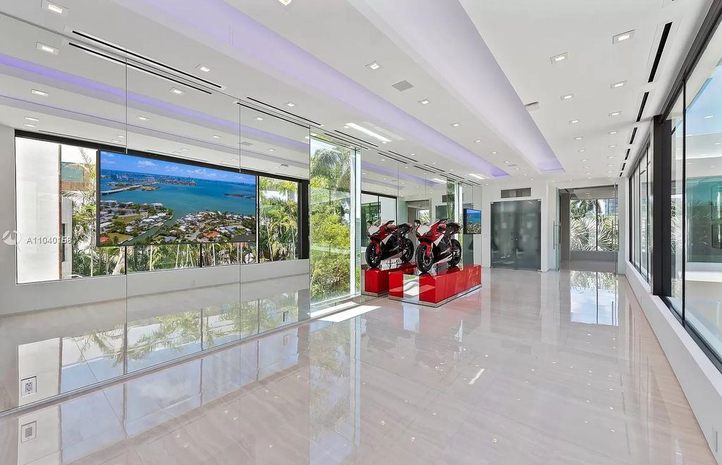 The Home in Miami is a brand new luxury modern estate with stunning bay views and over 100 feet of linear waterfront now available for sale. This home located at 1133 Belle Meade Island Dr, Miami, Florida