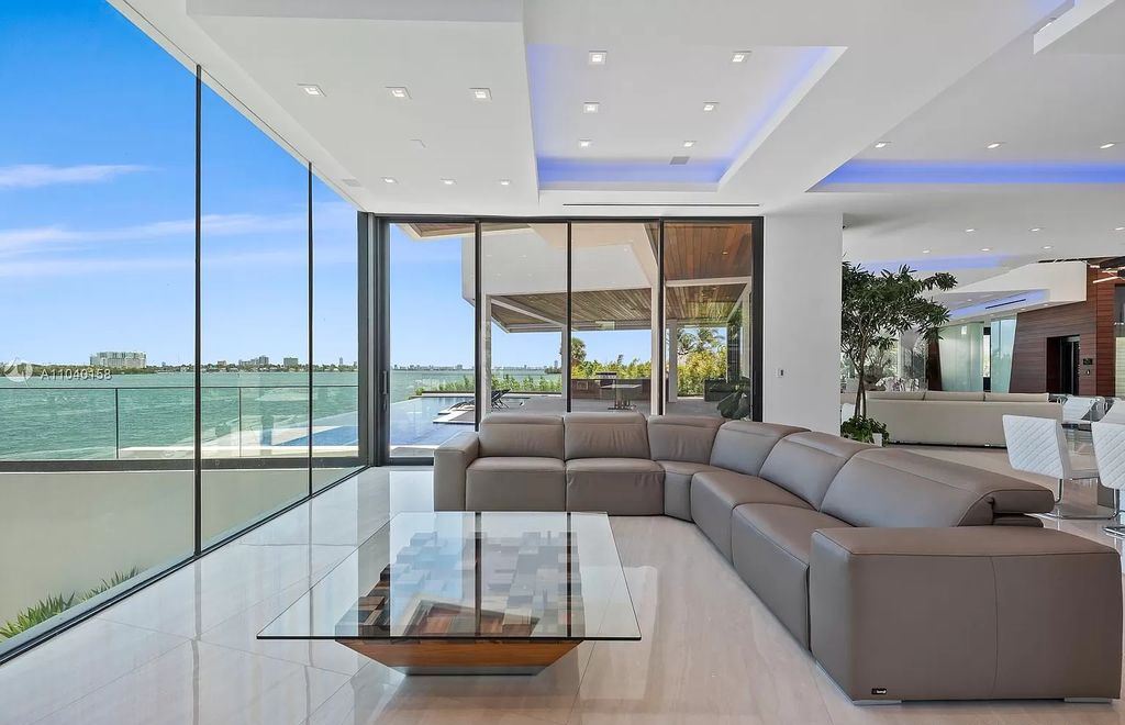 The Home in Miami is a brand new luxury modern estate with stunning bay views and over 100 feet of linear waterfront now available for sale. This home located at 1133 Belle Meade Island Dr, Miami, Florida