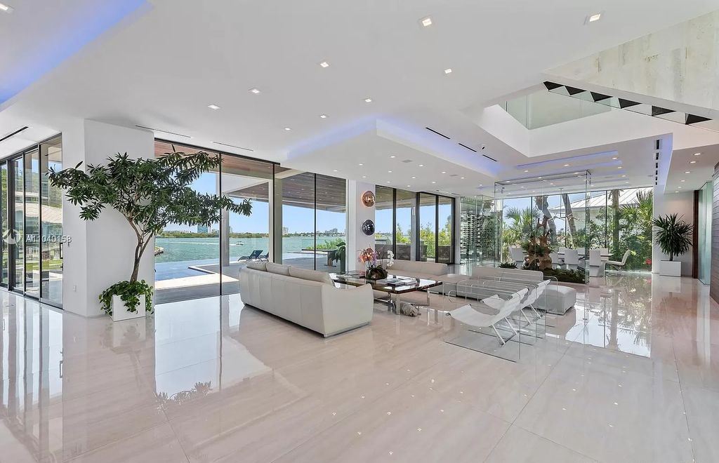 The Home in Miami is a brand new luxury modern estate with stunning bay views and over 100 feet of linear waterfront now available for sale. This home located at 1133 Belle Meade Island Dr, Miami, Florida