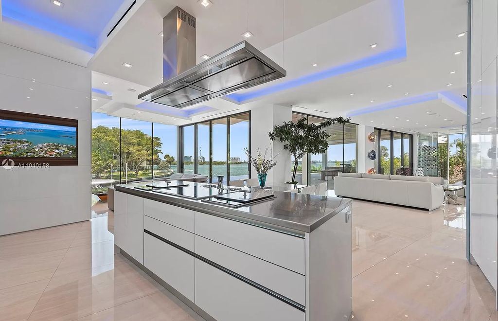 The Home in Miami is a brand new luxury modern estate with stunning bay views and over 100 feet of linear waterfront now available for sale. This home located at 1133 Belle Meade Island Dr, Miami, Florida