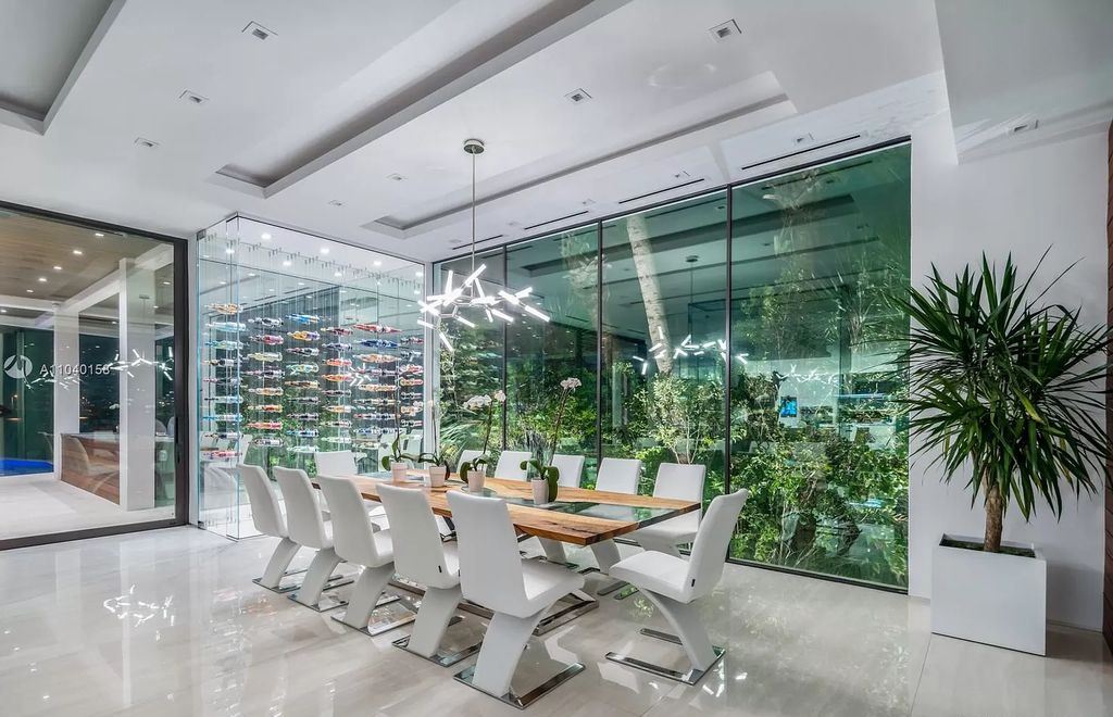 The Home in Miami is a brand new luxury modern estate with stunning bay views and over 100 feet of linear waterfront now available for sale. This home located at 1133 Belle Meade Island Dr, Miami, Florida