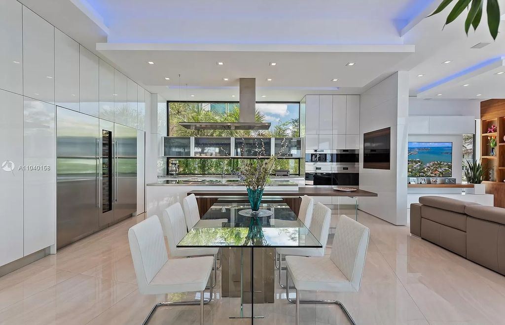 The Home in Miami is a brand new luxury modern estate with stunning bay views and over 100 feet of linear waterfront now available for sale. This home located at 1133 Belle Meade Island Dr, Miami, Florida
