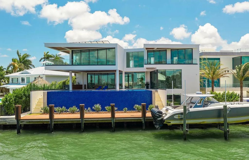 The Home in Miami is a brand new luxury modern estate with stunning bay views and over 100 feet of linear waterfront now available for sale. This home located at 1133 Belle Meade Island Dr, Miami, Florida