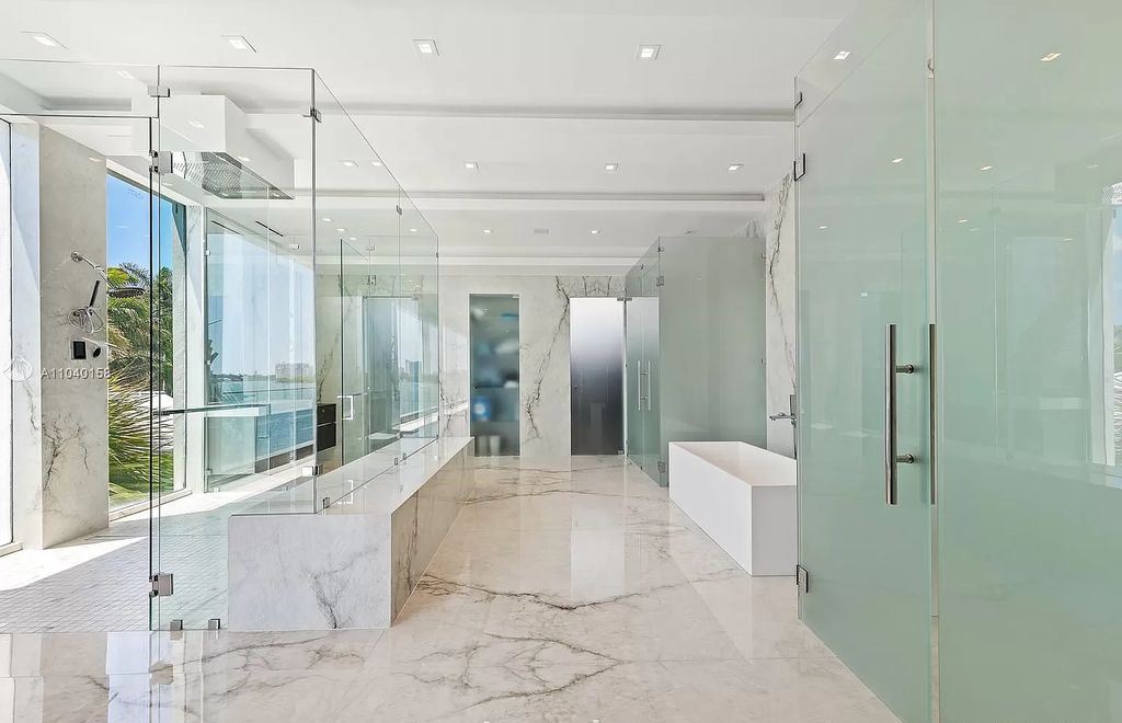 The Home in Miami is a brand new luxury modern estate with stunning bay views and over 100 feet of linear waterfront now available for sale. This home located at 1133 Belle Meade Island Dr, Miami, Florida